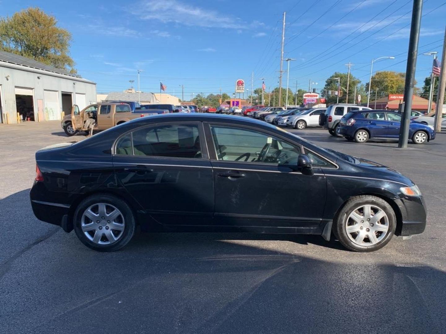 2010 BLACK HONDA CIVIC LX (2HGFA1F5XAH) with an 1.8L engine, Automatic transmission, located at 3100 Covert Avenue, Evansville, IN, 47714, (812) 473-4492, 37.955418, -87.512238 - Photo#2