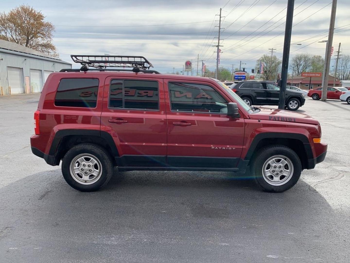 2015 RED JEEP PATRIOT SPORT (1C4NJRBB8FD) with an 2.4L engine, Continuously Variable transmission, located at 3100 Covert Avenue, Evansville, IN, 47714, (812) 473-4492, 37.955418, -87.512238 - Photo#2