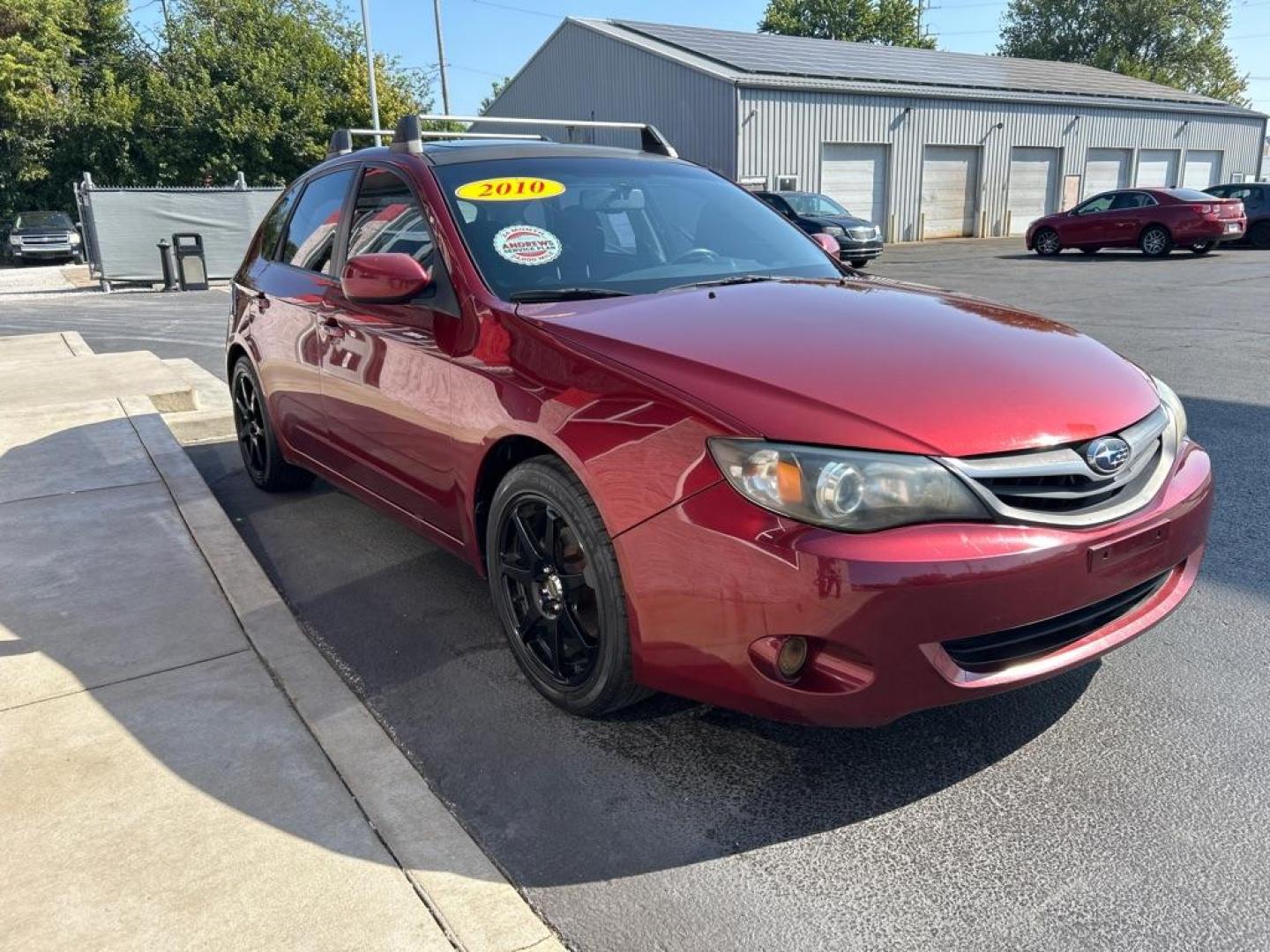 2010 RED SUBARU IMPREZA 2.5I PREMIUM (JF1GH6B62AH) with an 2.5L engine, Automatic transmission, located at 3100 Covert Avenue, Evansville, IN, 47714, (812) 473-4492, 37.955418, -87.512238 - Photo#2