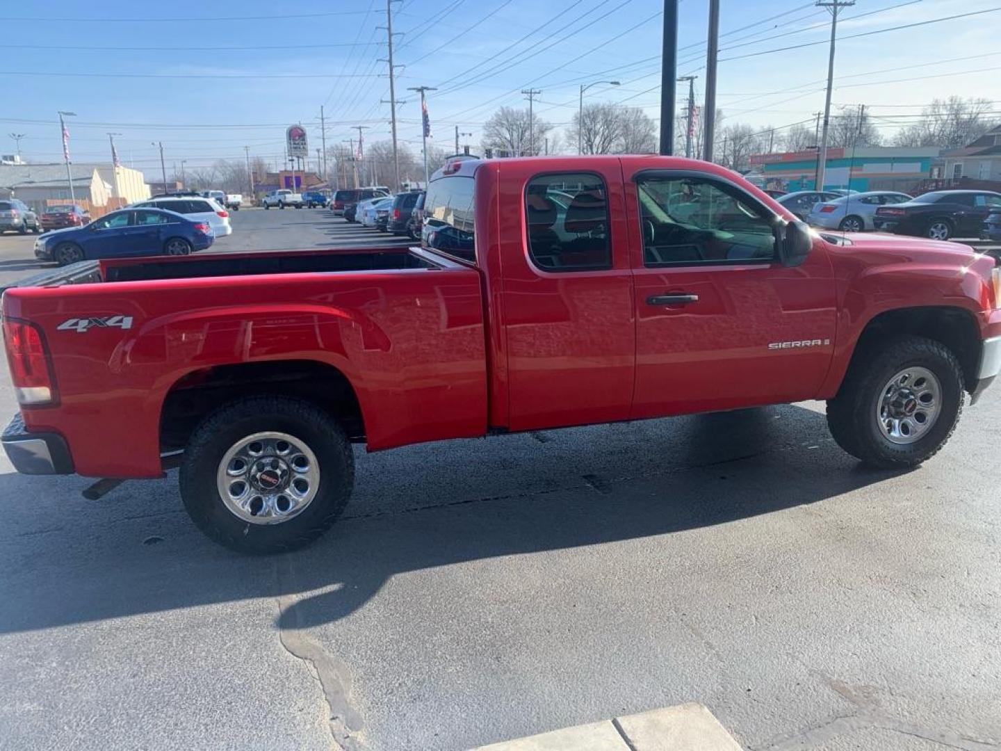 2009 RED GMC SIERRA 1500 (1GTEK19039Z) with an 5.3L engine, Automatic transmission, located at 3100 Covert Avenue, Evansville, IN, 47714, (812) 473-4492, 37.955418, -87.512238 - Photo#1