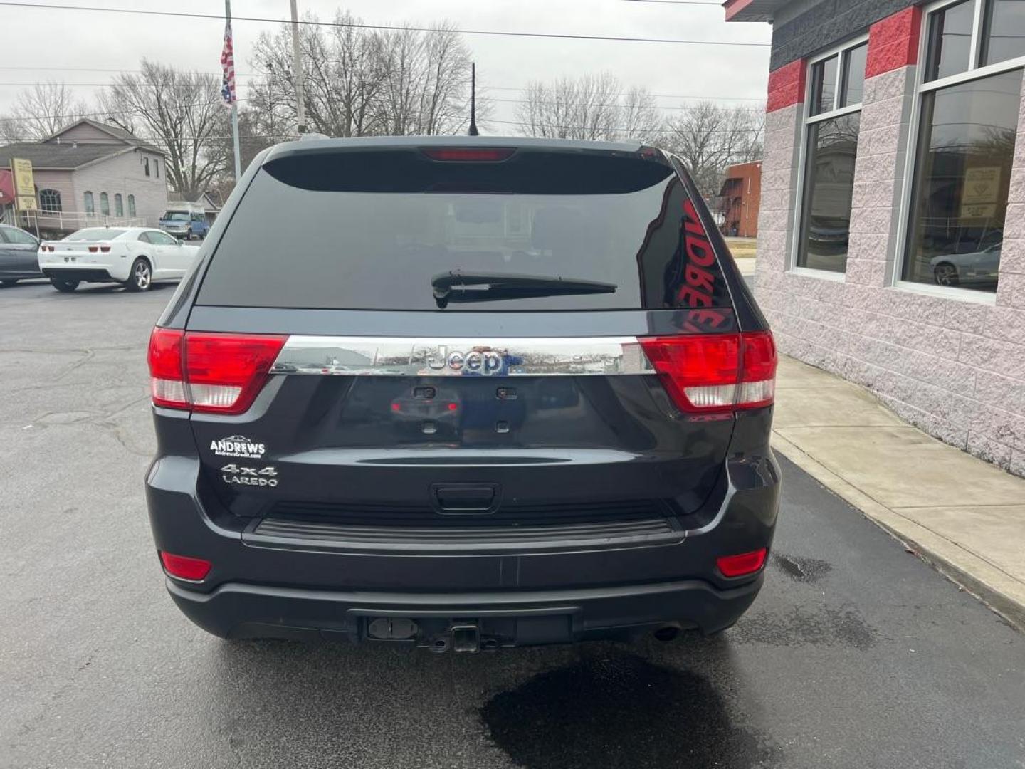 2012 BLUE JEEP GRAND CHEROKEE LAREDO (1C4RJFAG3CC) with an 3.6L engine, Automatic transmission, located at 3100 Covert Avenue, Evansville, IN, 47714, (812) 473-4492, 37.955418, -87.512238 - Photo#4