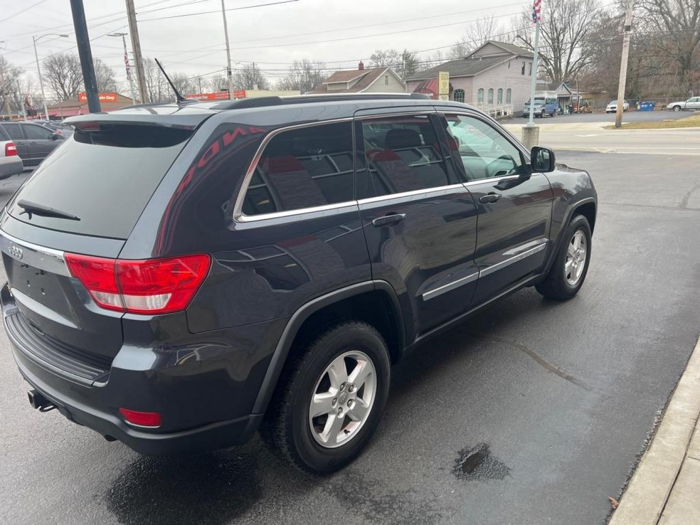 2012 BLUE JEEP GRAND CHEROKEE LAREDO (1C4RJFAG3CC) with an 3.6L engine, Automatic transmission, located at 3100 Covert Avenue, Evansville, IN, 47714, (812) 473-4492, 37.955418, -87.512238 - Photo#5