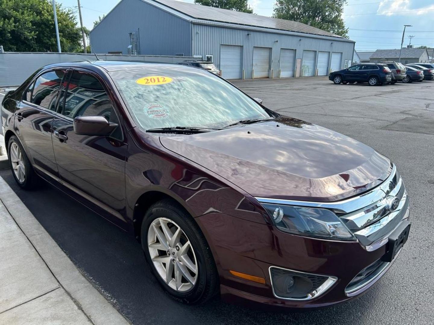 2012 RED FORD FUSION SEL (3FAHP0JG7CR) with an 3.0L engine, Automatic transmission, located at 3100 Covert Avenue, Evansville, IN, 47714, (812) 473-4492, 37.955418, -87.512238 - Photo#2