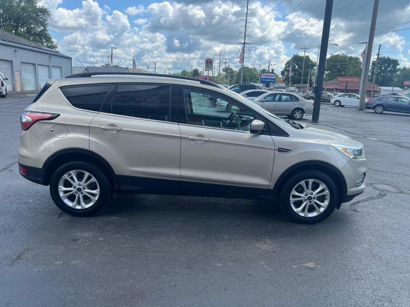 2017 SILVER FORD ESCAPE SE (1FMCU9GD8HU) with an 1.5L engine, Automatic transmission, located at 3100 Covert Avenue, Evansville, IN, 47714, (812) 473-4492, 37.955418, -87.512238 - Photo#2