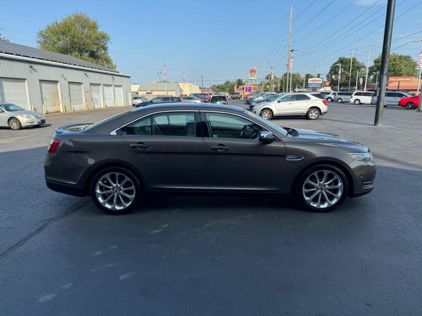 2015 BROWN FORD TAURUS LIMITED (1FAHP2F81FG) with an 3.5L engine, Automatic transmission, located at 3100 Covert Avenue, Evansville, IN, 47714, (812) 473-4492, 37.955418, -87.512238 - Photo#2