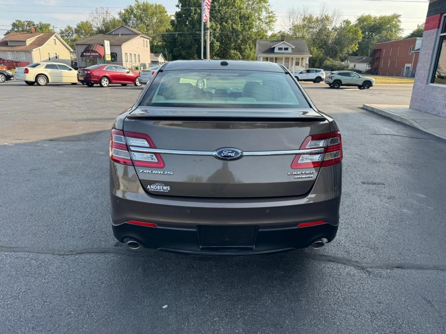 2015 BROWN FORD TAURUS LIMITED (1FAHP2F81FG) with an 3.5L engine, Automatic transmission, located at 3100 Covert Avenue, Evansville, IN, 47714, (812) 473-4492, 37.955418, -87.512238 - Photo#3