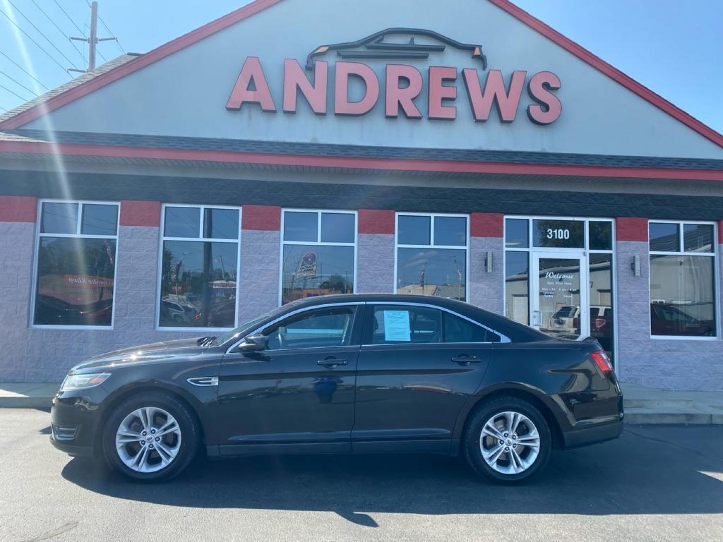 2015 BLACK FORD TAURUS SEL (1FAHP2H81FG) with an 3.5L engine, Automatic transmission, located at 3100 Covert Avenue, Evansville, IN, 47714, (812) 473-4492, 37.955418, -87.512238 - Photo#0