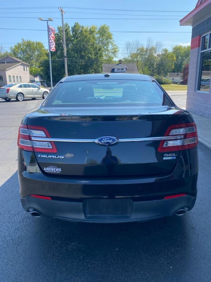 2015 BLACK FORD TAURUS SEL (1FAHP2H81FG) with an 3.5L engine, Automatic transmission, located at 3100 Covert Avenue, Evansville, IN, 47714, (812) 473-4492, 37.955418, -87.512238 - Photo#3