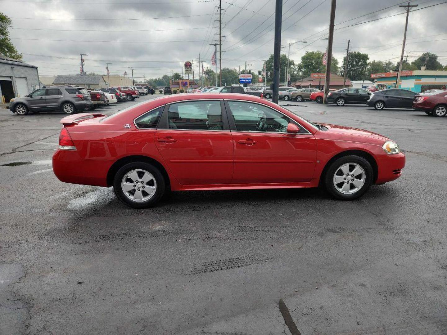 2009 RED CHEVROLET IMPALA 1LT (2G1WT57N791) with an 3.5L engine, Automatic transmission, located at 3100 Covert Avenue, Evansville, IN, 47714, (812) 473-4492, 37.955418, -87.512238 - Photo#5