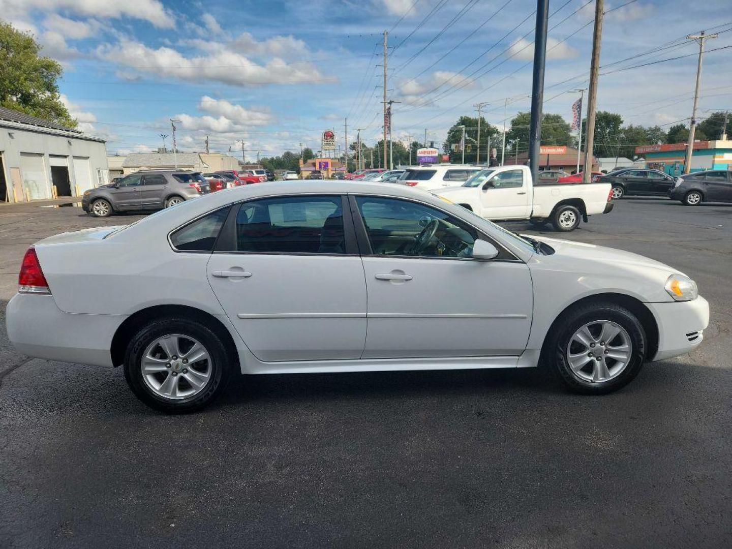 2012 WHITE CHEVROLET IMPALA LS (2G1WF5E31C1) with an 3.6L engine, Automatic transmission, located at 3100 Covert Avenue, Evansville, IN, 47714, (812) 473-4492, 37.955418, -87.512238 - Photo#5