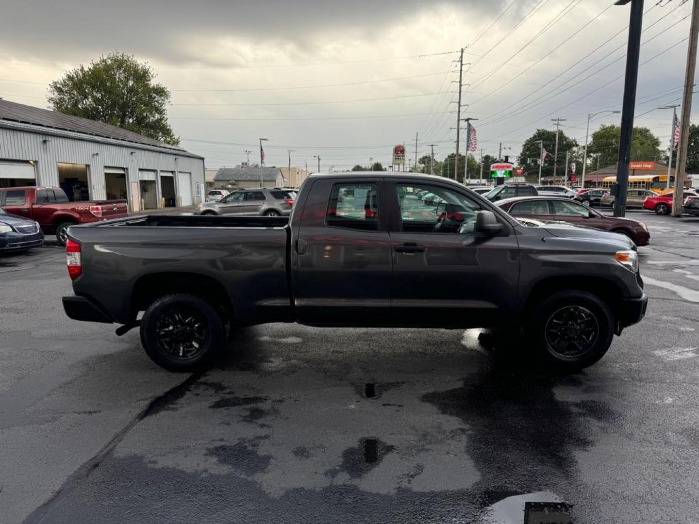 2014 BLACK TOYOTA TUNDRA DOUBLE CAB SR/SR5 (5TFRM5F18EX) with an 4.6L engine, Automatic transmission, located at 3100 Covert Avenue, Evansville, IN, 47714, (812) 473-4492, 37.955418, -87.512238 - Photo#2