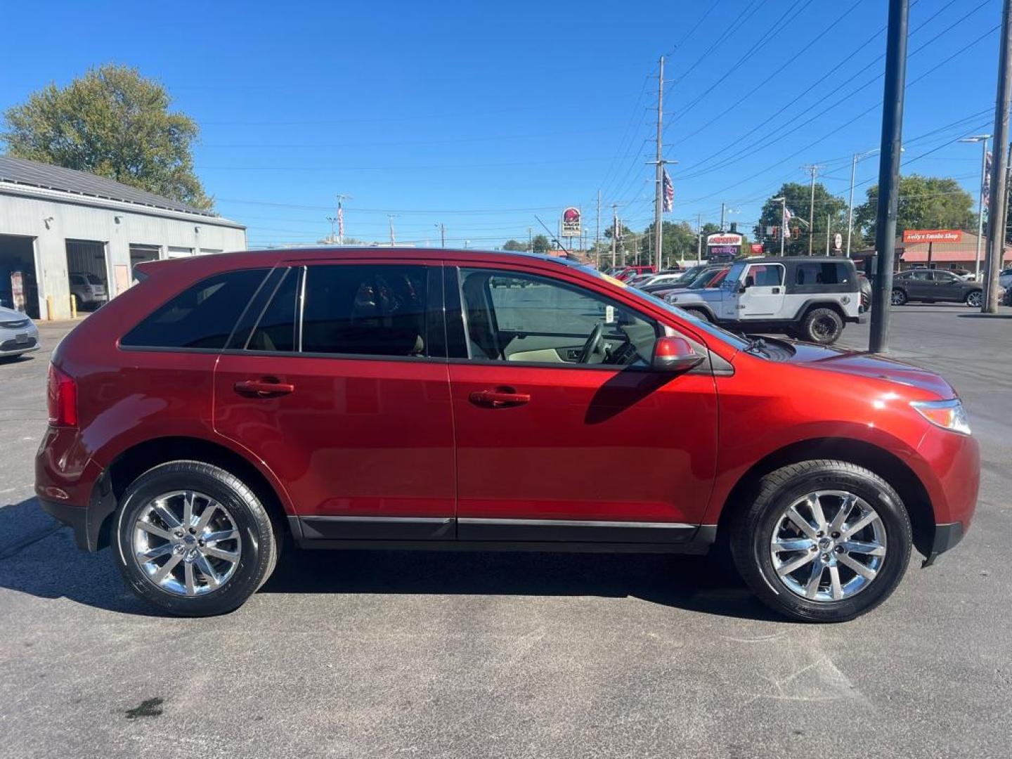 2014 ORANGE FORD EDGE SEL (2FMDK4JC7EB) with an 3.5L engine, Automatic transmission, located at 3100 Covert Avenue, Evansville, IN, 47714, (812) 473-4492, 37.955418, -87.512238 - Photo#2