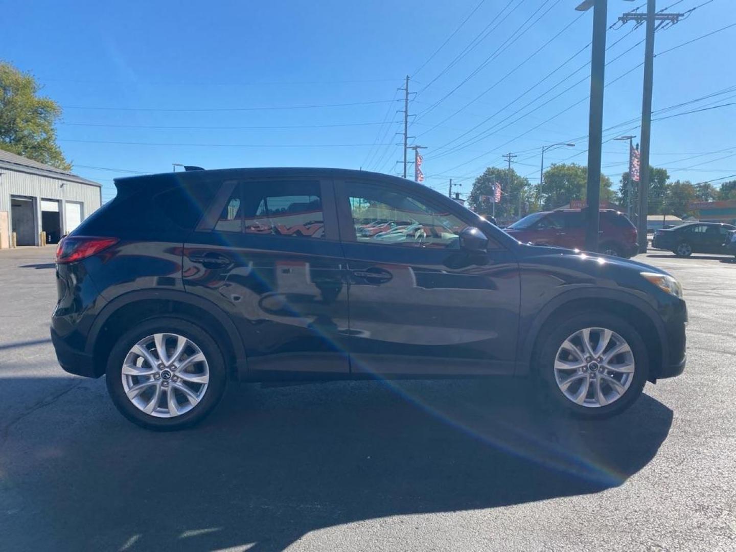 2013 BLACK MAZDA CX-5 GT (JM3KE2DE6D0) with an 2.0L engine, Automatic transmission, located at 3100 Covert Avenue, Evansville, IN, 47714, (812) 473-4492, 37.955418, -87.512238 - Photo#2