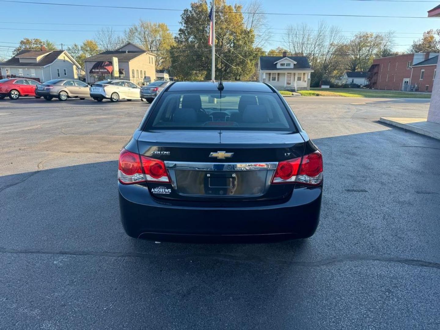 2016 BLACK CHEVROLET CRUZE LIMITED LT (1G1PE5SB0G7) with an 1.4L engine, Automatic transmission, located at 3100 Covert Avenue, Evansville, IN, 47714, (812) 473-4492, 37.955418, -87.512238 - Photo#3