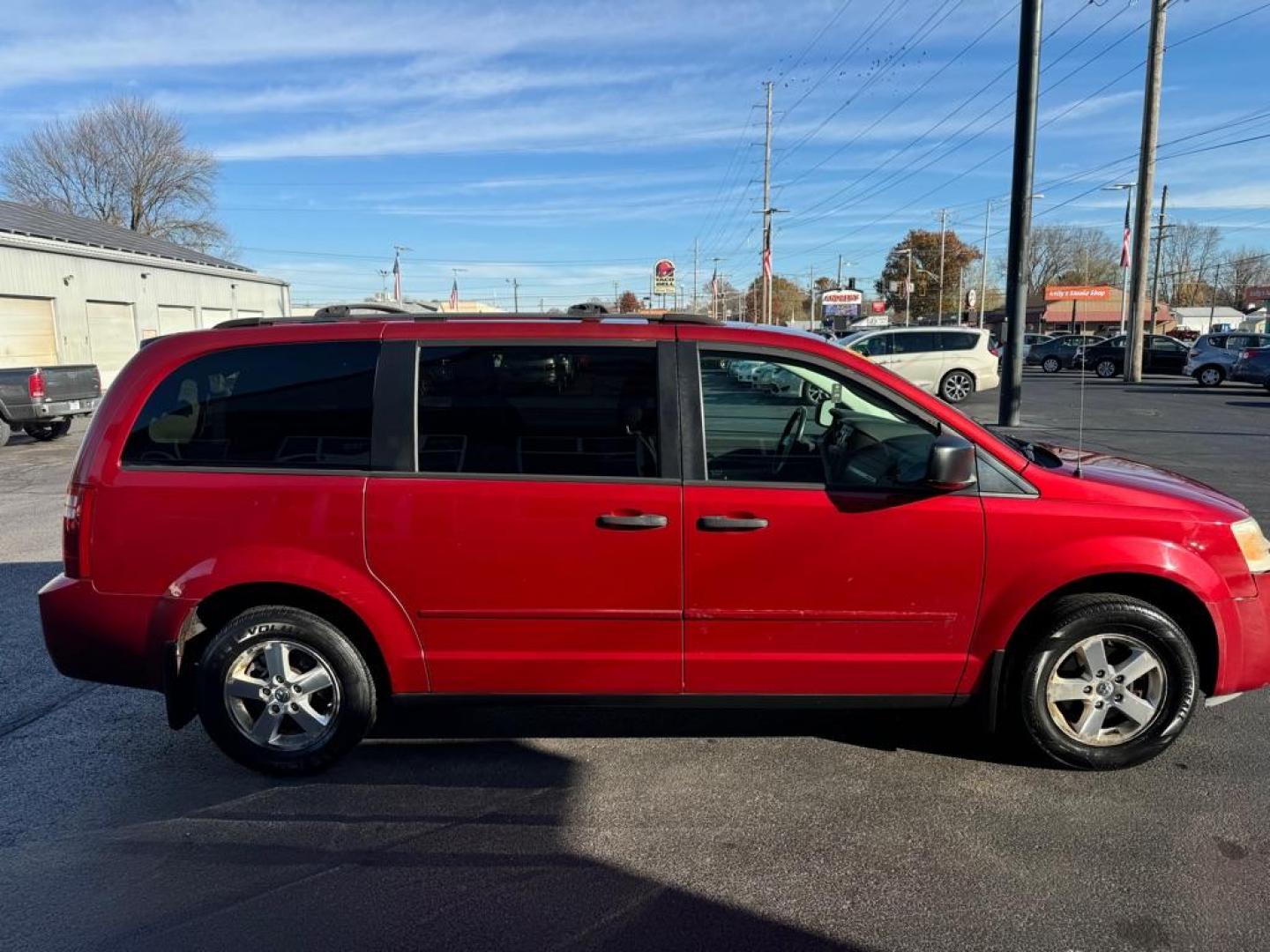 2008 RED DODGE GRAND CARAVAN SE (2D8HN44H58R) with an 3.3L engine, Automatic transmission, located at 3100 Covert Avenue, Evansville, IN, 47714, (812) 473-4492, 37.955418, -87.512238 - Photo#2