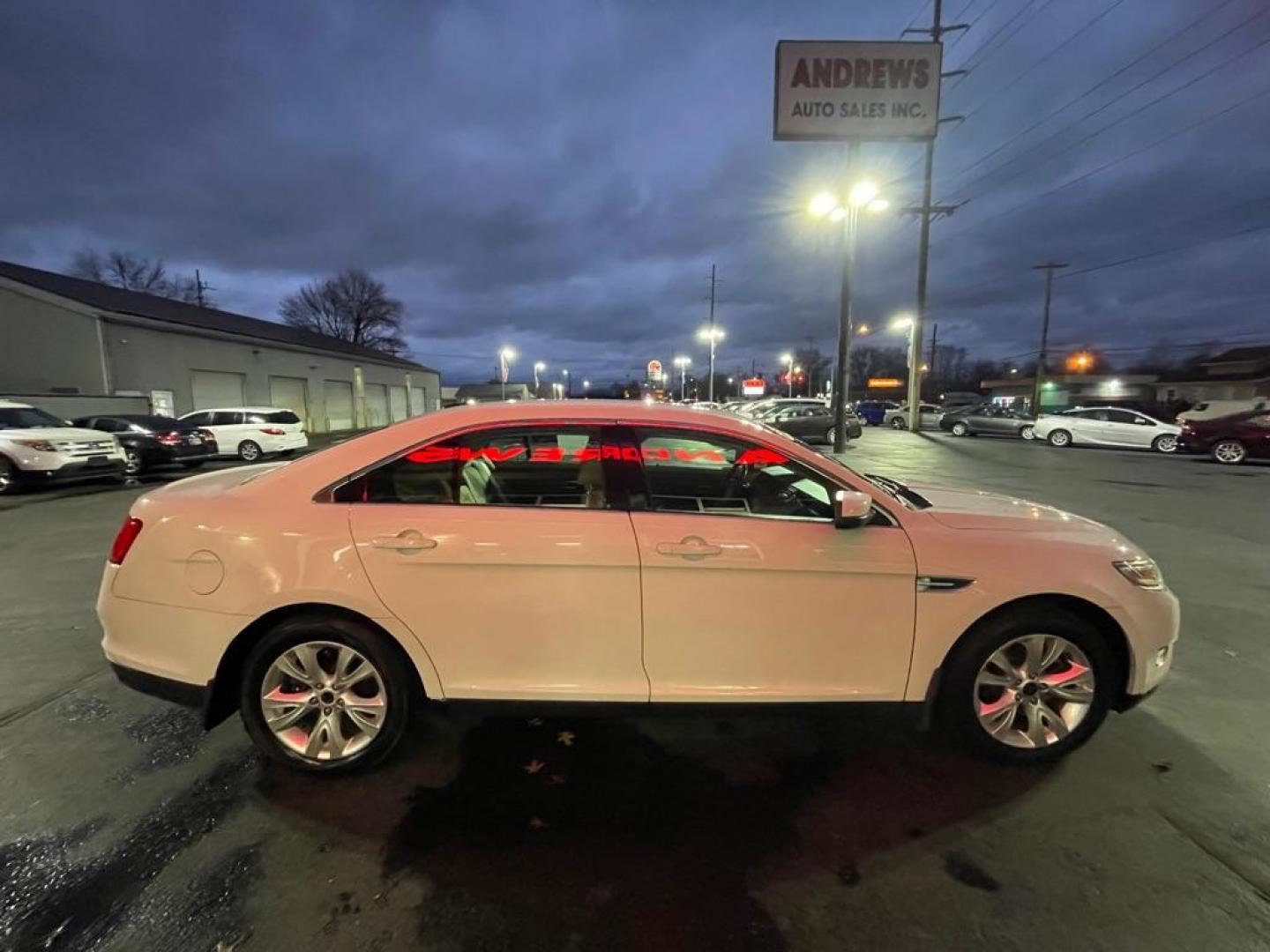 2012 WHITE FORD TAURUS SEL (1FAHP2EW9CG) with an 3.5L engine, Automatic transmission, located at 3100 Covert Avenue, Evansville, IN, 47714, (812) 473-4492, 37.955418, -87.512238 - Photo#2