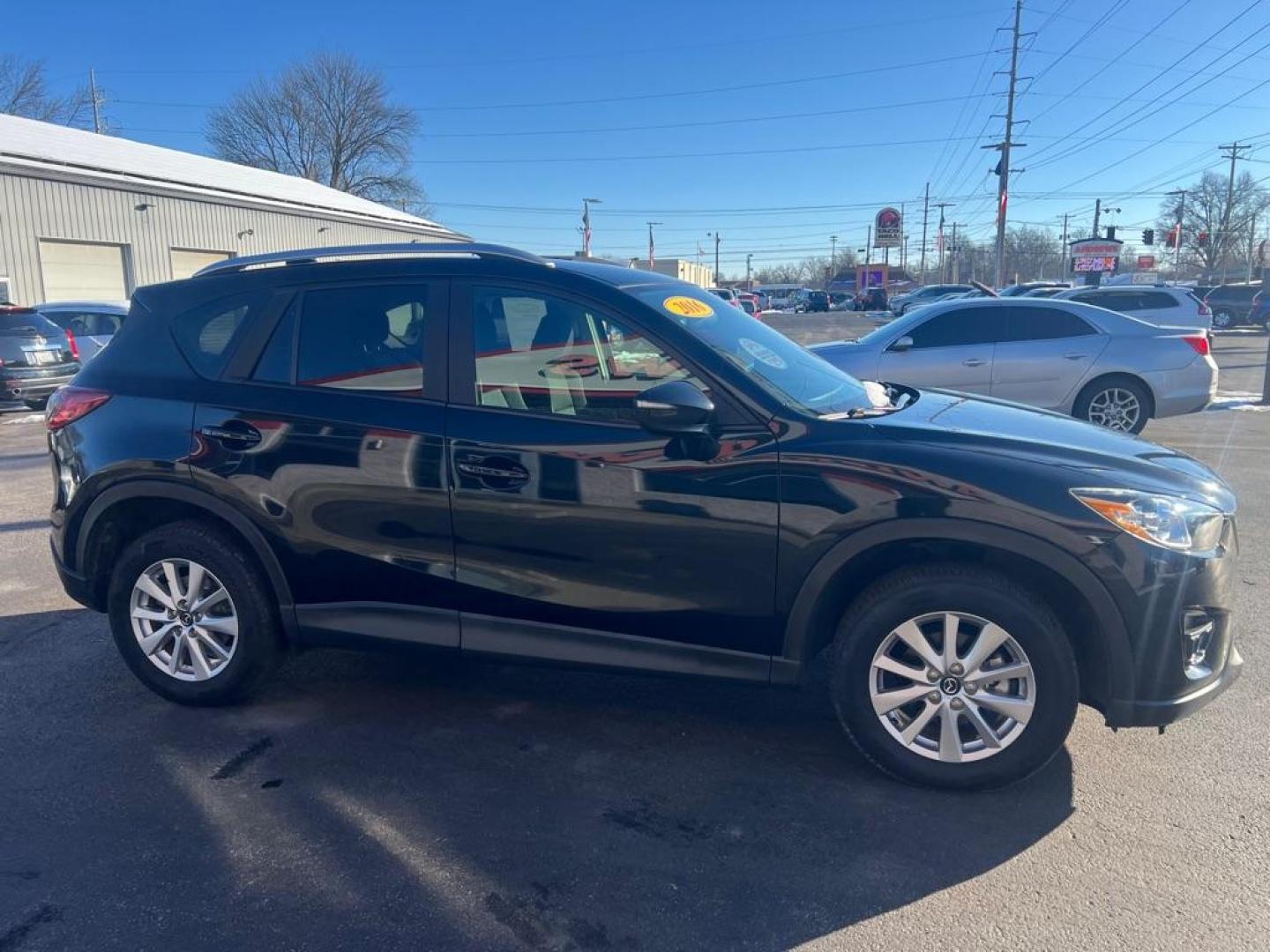 2016 BLACK MAZDA CX-5 TOURING (JM3KE4CY3G0) with an 2.5L engine, Automatic transmission, located at 3100 Covert Avenue, Evansville, IN, 47714, (812) 473-4492, 37.955418, -87.512238 - Photo#2