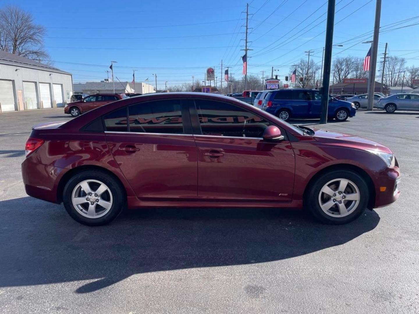 2016 RED CHEVROLET CRUZE LIMITED LT (1G1PE5SB9G7) with an 1.4L engine, Automatic transmission, located at 3100 Covert Avenue, Evansville, IN, 47714, (812) 473-4492, 37.955418, -87.512238 - Photo#2