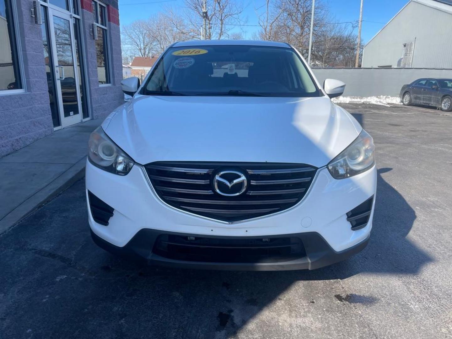 2016 WHITE MAZDA CX-5 SPORT (JM3KE4BY2G0) with an 2.5L engine, 6-Speed Manual transmission, located at 3100 Covert Avenue, Evansville, IN, 47714, (812) 473-4492, 37.955418, -87.512238 - Photo#1