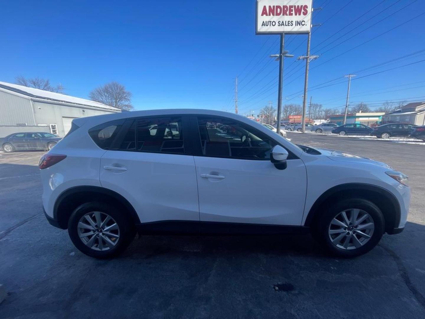 2016 WHITE MAZDA CX-5 SPORT (JM3KE4BY2G0) with an 2.5L engine, 6-Speed Manual transmission, located at 3100 Covert Avenue, Evansville, IN, 47714, (812) 473-4492, 37.955418, -87.512238 - Photo#2