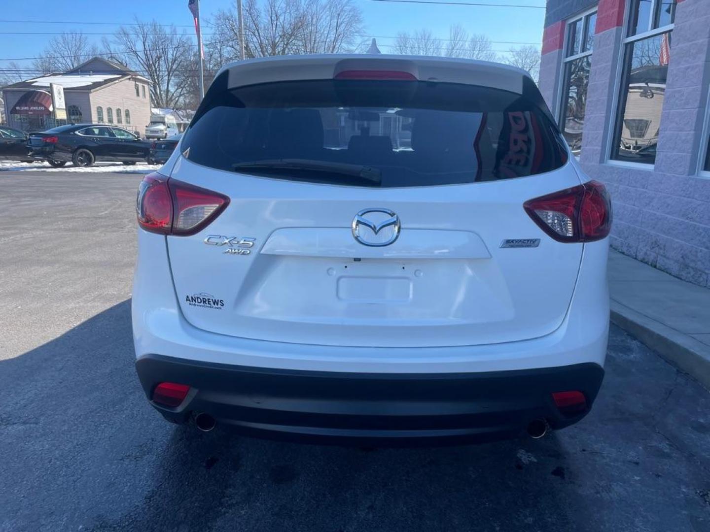 2016 WHITE MAZDA CX-5 SPORT (JM3KE4BY2G0) with an 2.5L engine, 6-Speed Manual transmission, located at 3100 Covert Avenue, Evansville, IN, 47714, (812) 473-4492, 37.955418, -87.512238 - Photo#3