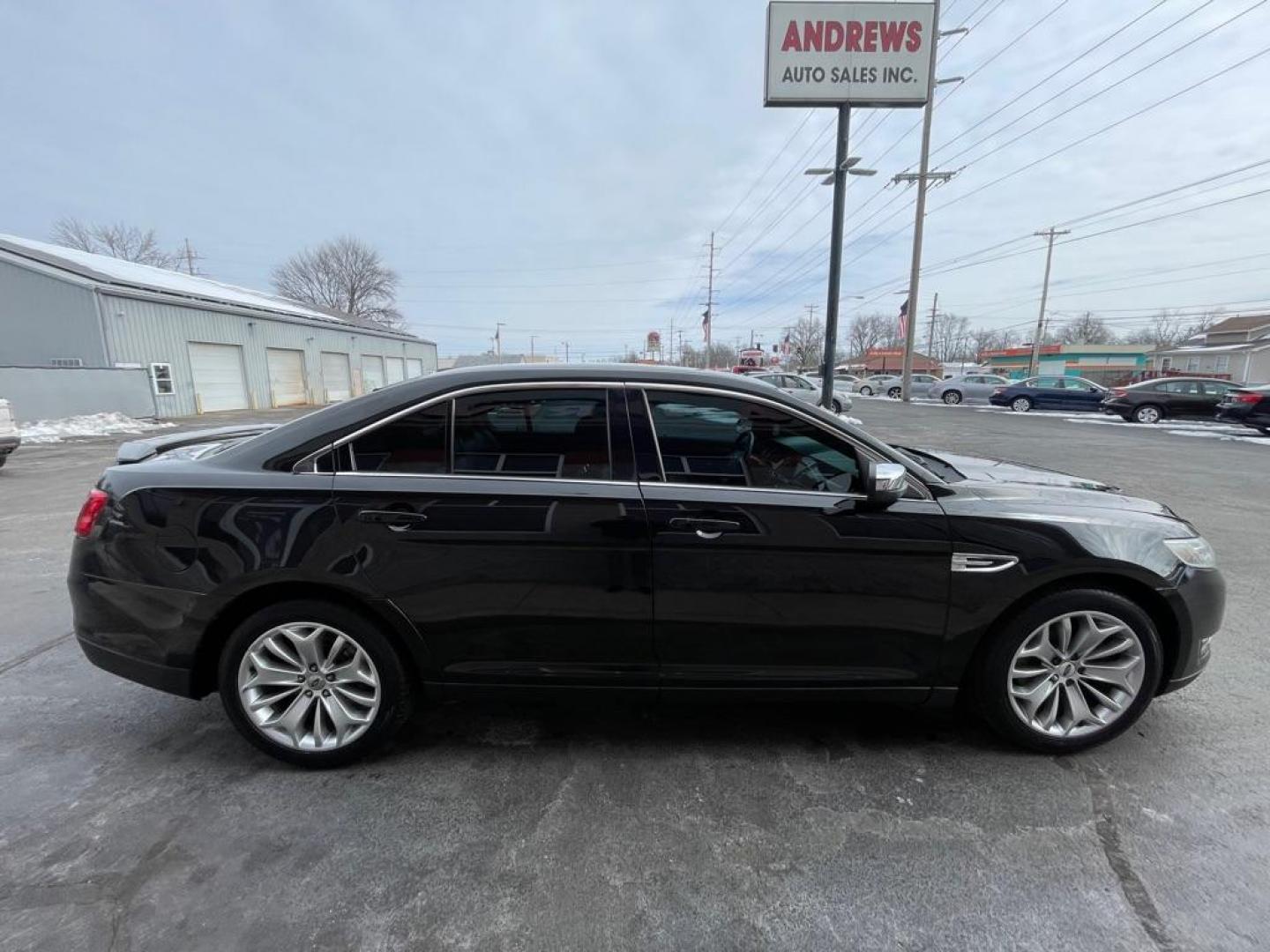 2015 BLACK FORD TAURUS LIMITED (1FAHP2F84FG) with an 3.5L engine, Automatic transmission, located at 3100 Covert Avenue, Evansville, IN, 47714, (812) 473-4492, 37.955418, -87.512238 - Photo#2