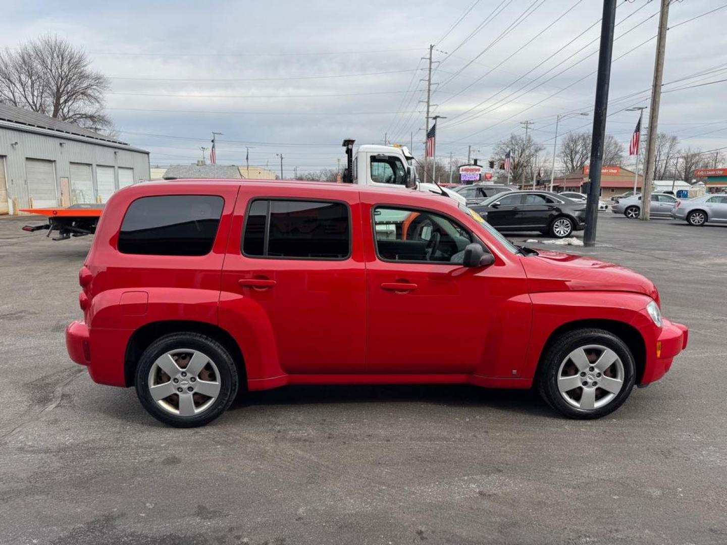 2009 RED CHEVROLET HHR LS (3GNCA13B99S) with an 2.2L engine, Automatic transmission, located at 3100 Covert Avenue, Evansville, IN, 47714, (812) 473-4492, 37.955418, -87.512238 - Photo#2